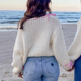 Bea | One Shoulder Chunky Knit Pullover mit rosa Kontrastband Schleife Akzente